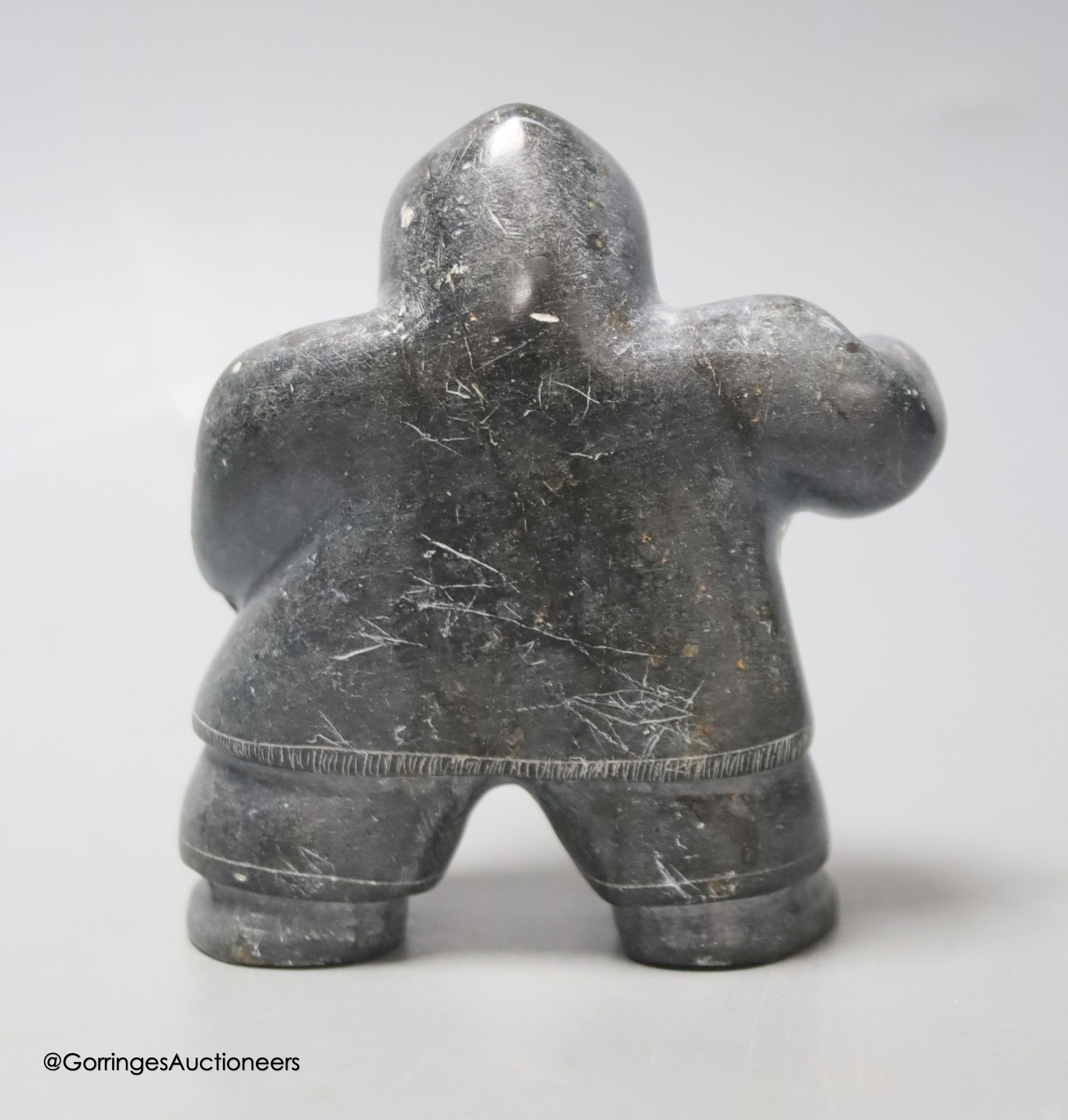 A carved stone inuit eskimo fisherman, height 11cm